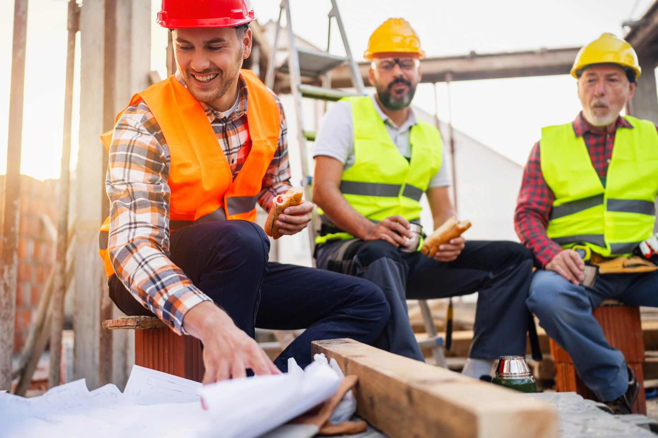 Construction team reviewing plans on site